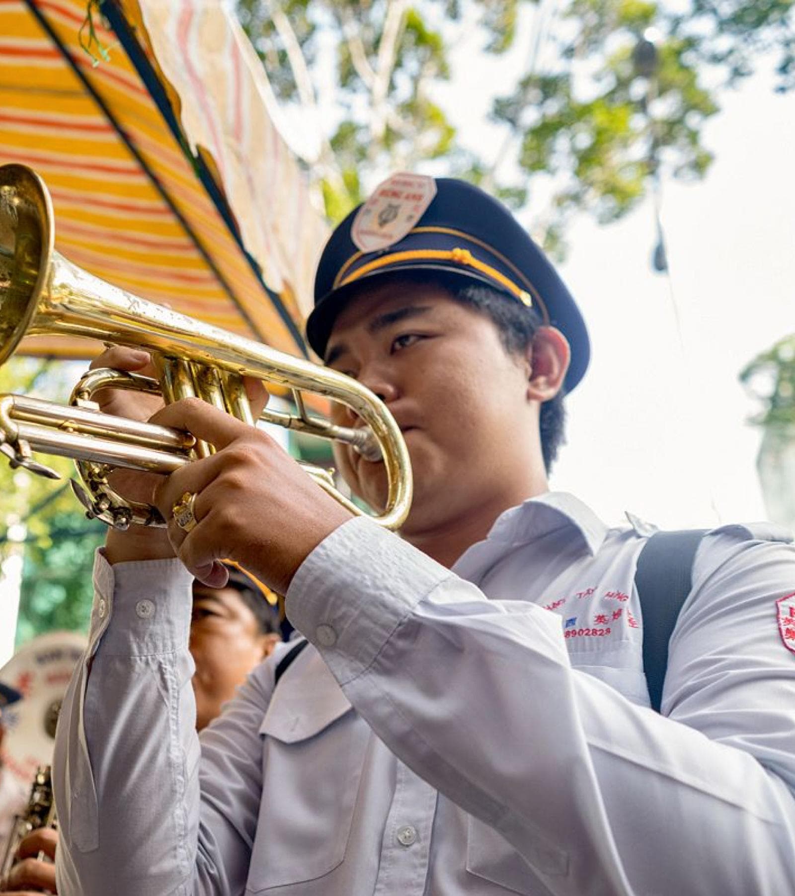 Trumpet player in Vietnamese brass band
